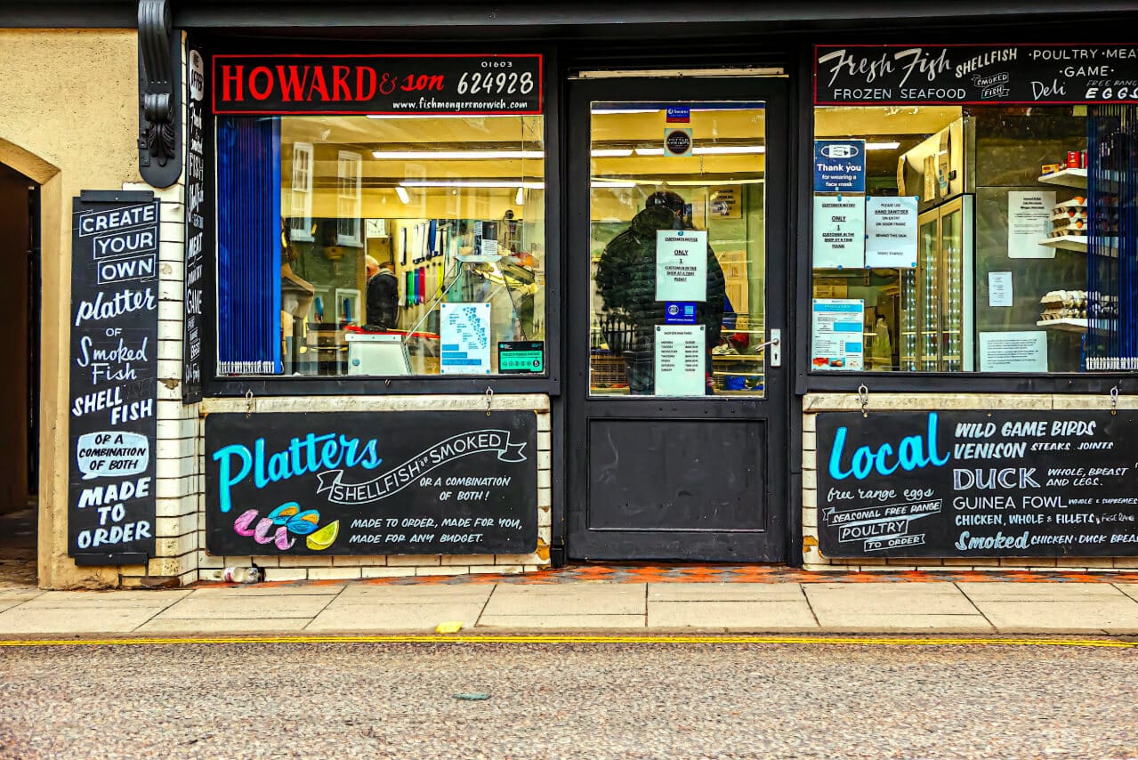 A shopfront with a painted offers and sinage, the kind of local business still found through Google's local map pack rather than an AI summary